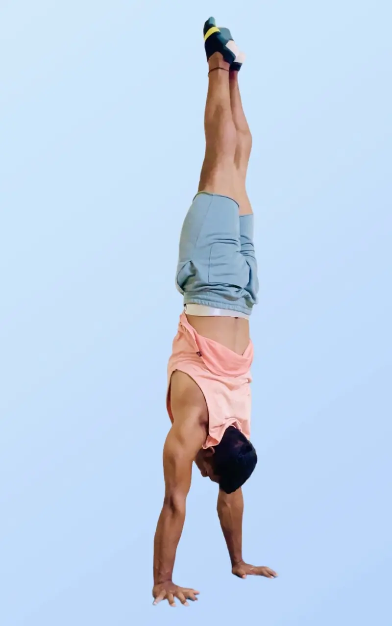 Wall handstand drill showing a vertical body line